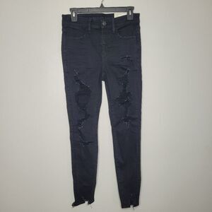 American Eagle black high rise jegging extreme distressing  stretch Size 6 NWT